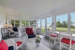 Amazing screen porch on the front of Liberty Bluff with Lake Michigan views